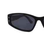 Black luxury rectangle eyeglasses with golden accents, perspective from the front zoomed in