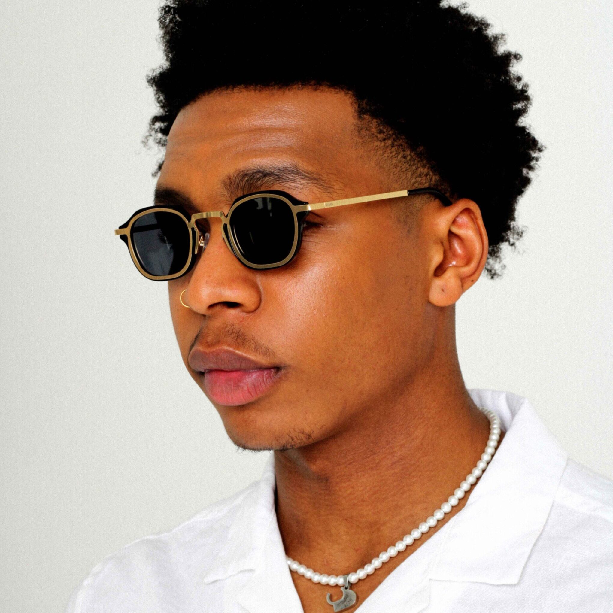 Black male Model wearing Control Sunglasses, luxurious rectangle sunglasses by AKA SAVRAN