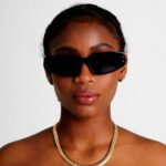 Black Female Model wearing Faith Sunglasses, luxurious rectangle sunglasses by AKA SAVRAN
