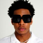 Black Male model wearing Lunaire Oversized Sunglasses, Black acetate Sunglasses by AKA SAVRAN