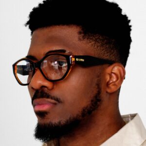 Black Male model wearing Revolution rectangle Eyeglasses, Black acetate eyeglasses by AKA SAVRAN, with Orange accents