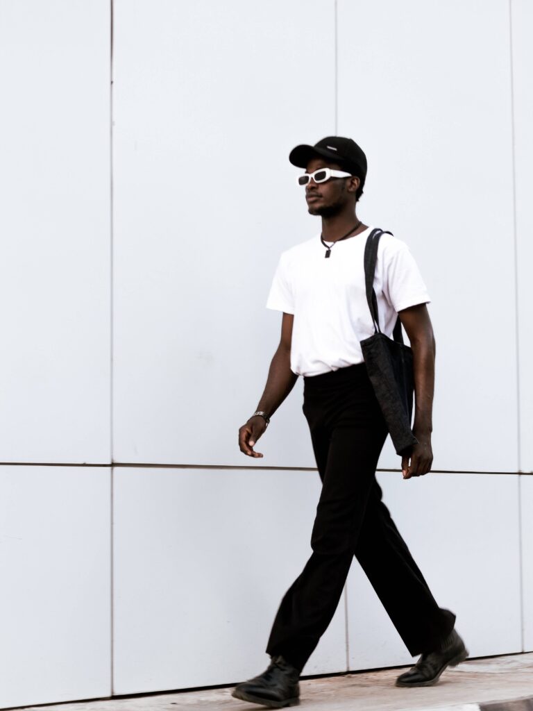 black man with minimalistic outfit with black and white sunglasses for men