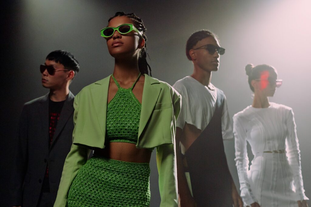 Group of black and asian men and women wearing luxury fasionable outfits and black sunglasses, one of the big trends according to AKA SAVRAN blog