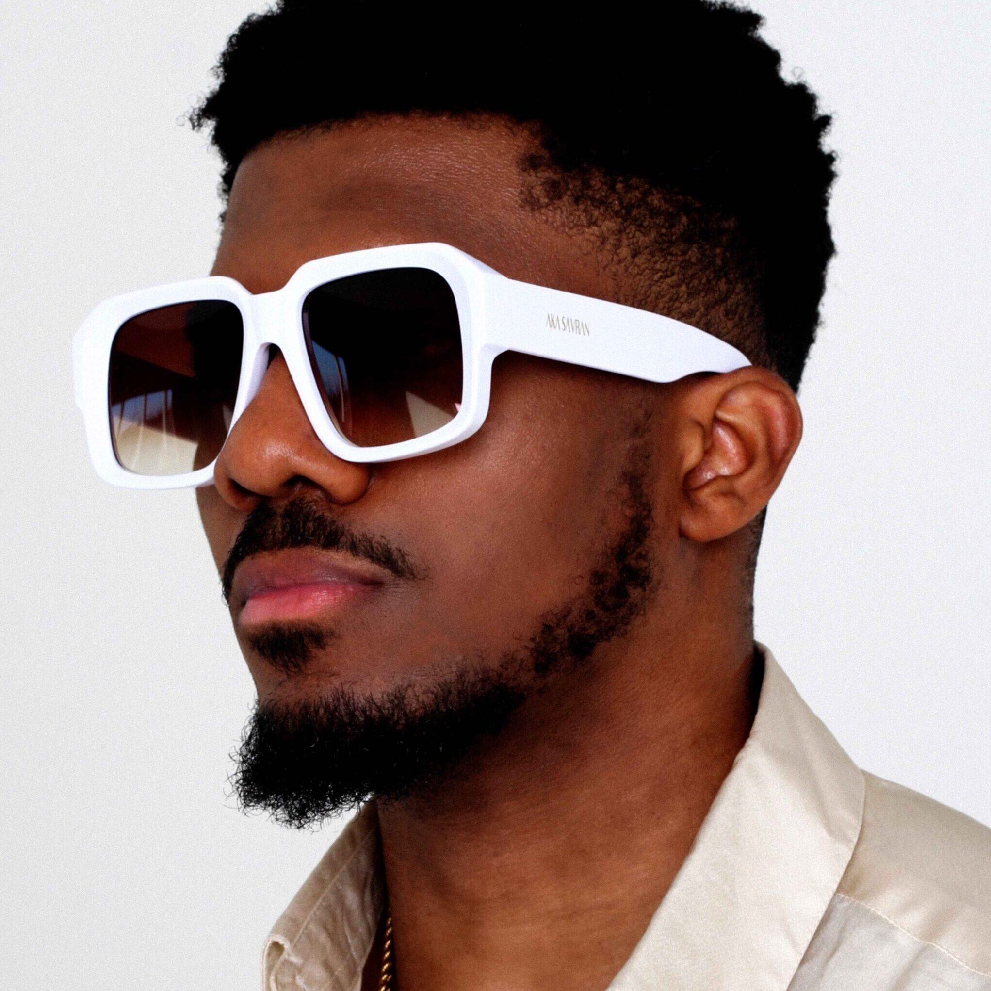 Black Male Model wearing Lumiere Oversized Sunglasses, luxurious square sunglasses by AKA SAVRAN